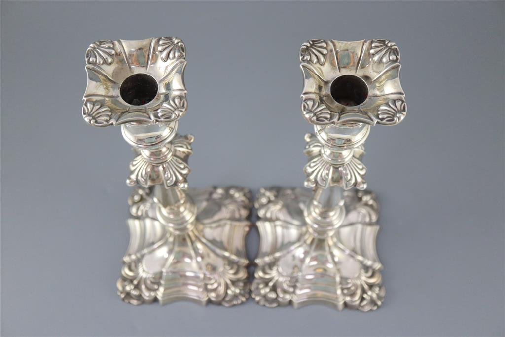 A pair of Edwardian silver candlesticks by William Hutton & Sons,